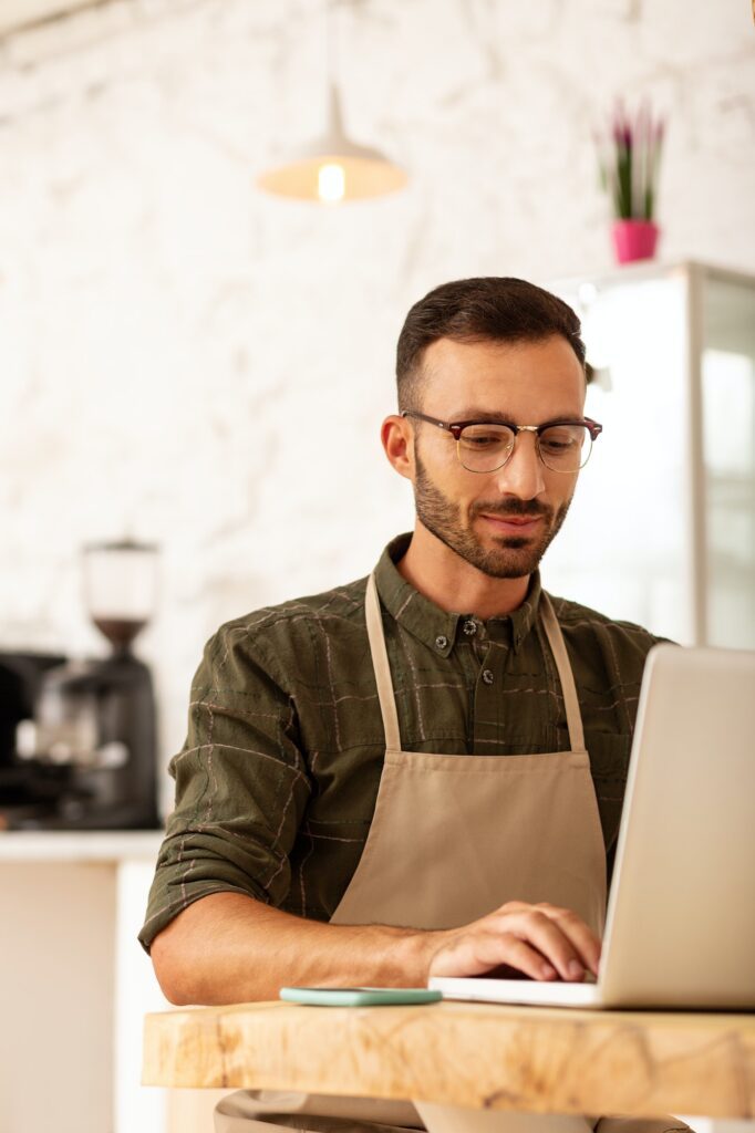 Owner of coffee shop developing business strategy